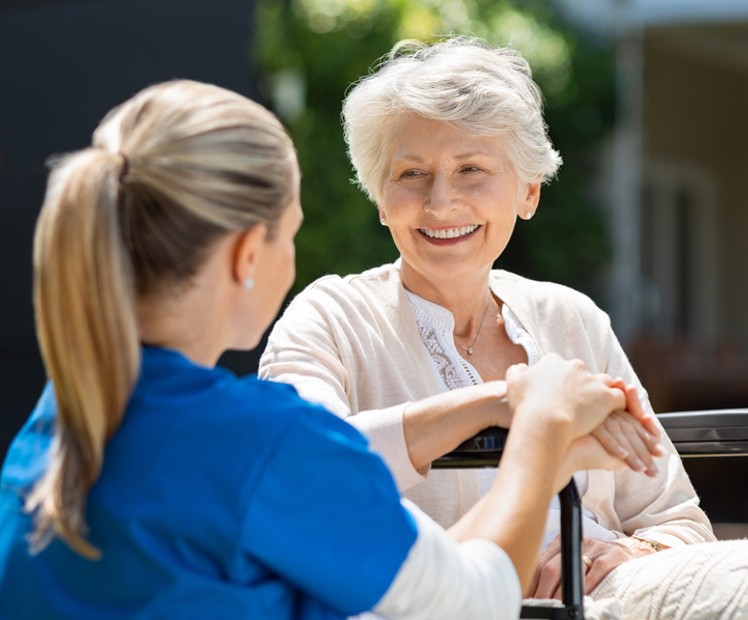 nurse seeing elderly patient