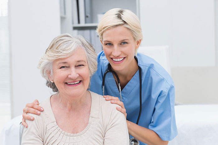 nurse smiling with happy patient